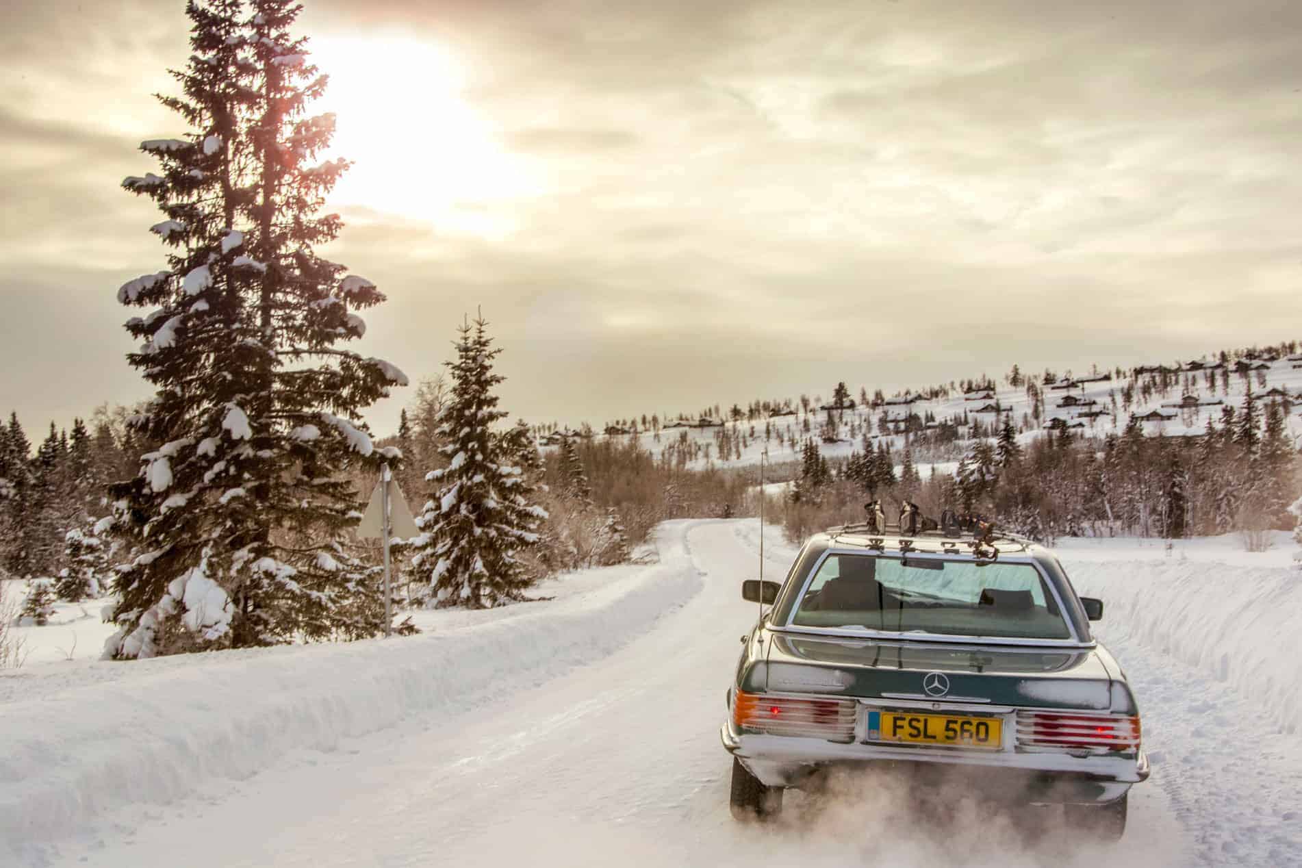 1980s Mercedes 560SL tackling Norway's snowy roads.