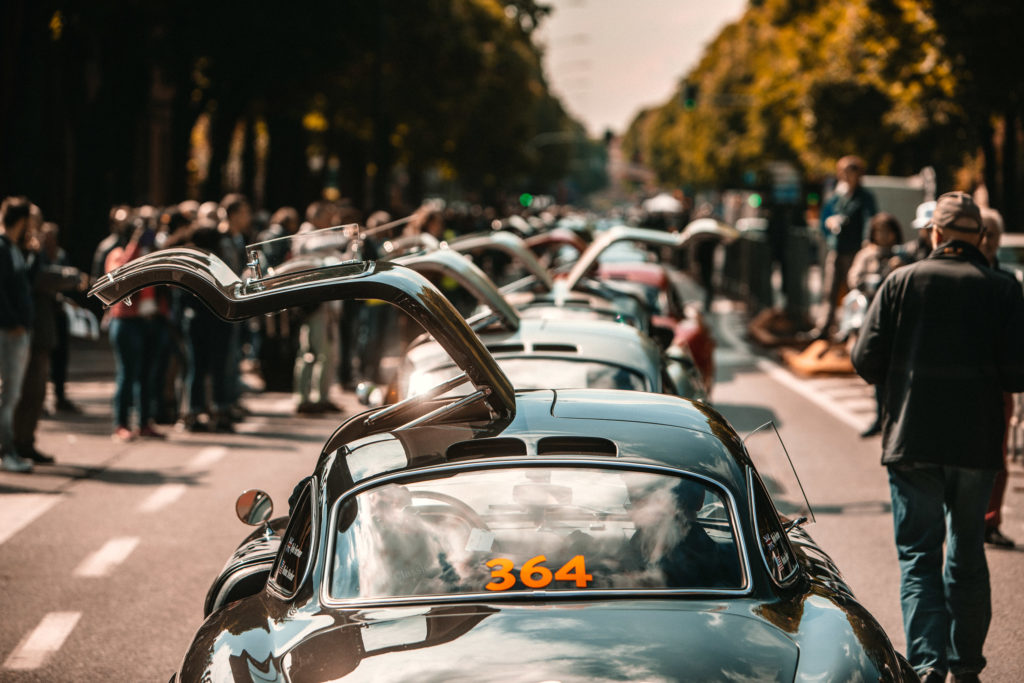 A procession of 300SL Gullwing's with their doors open