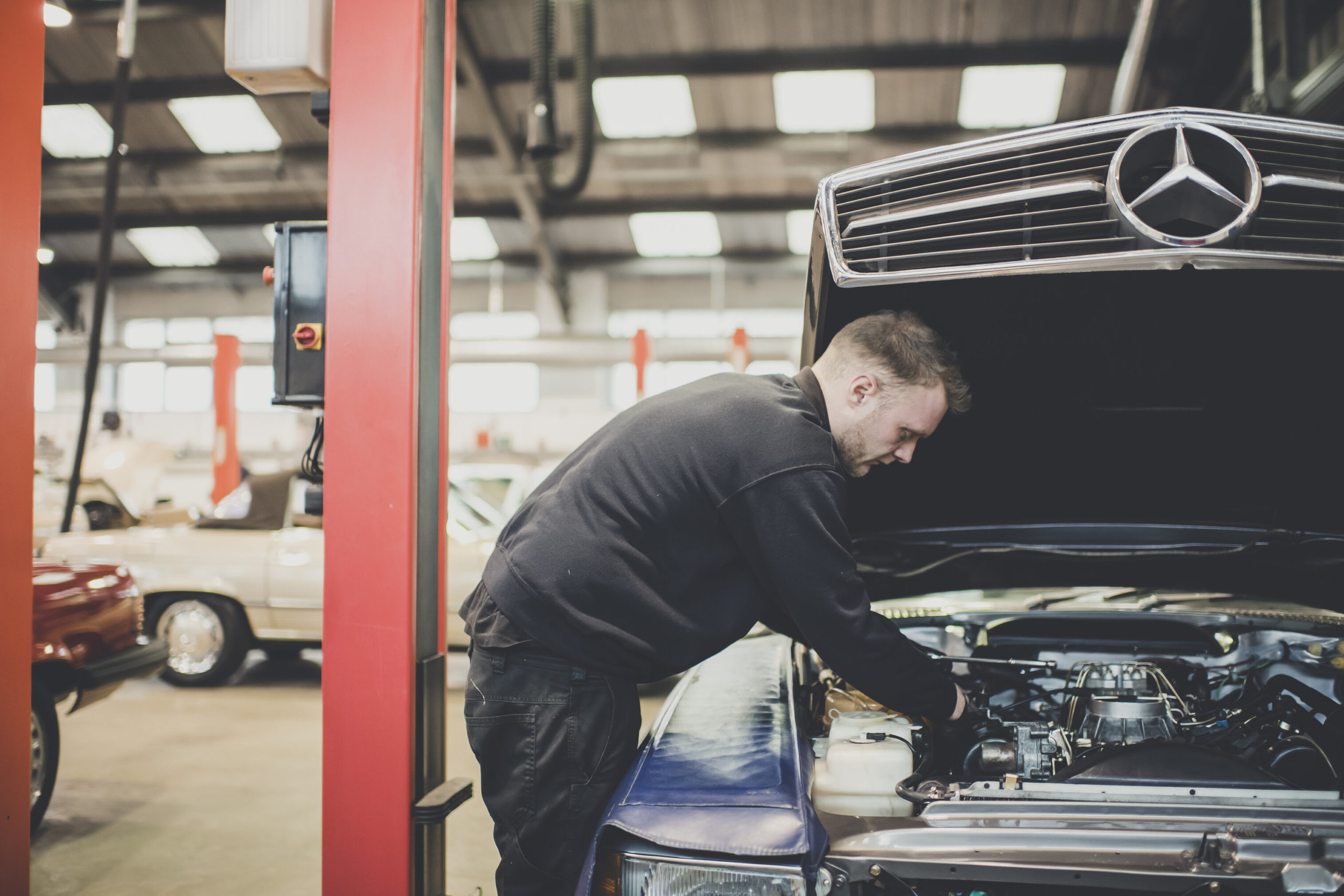 Our oldest craftsman checking over components that are affected by E10 fuel in an old Mercedes