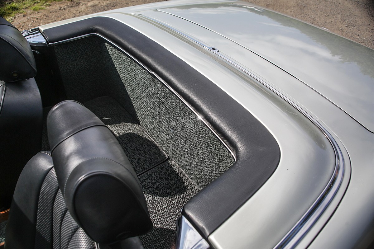 Black leather interior of a left-hand drive 280SL Mercedes