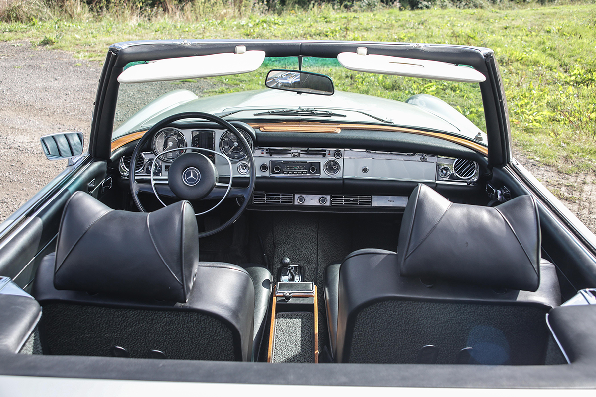 Black leather interior of a Mercedes 280 sl from the seventies