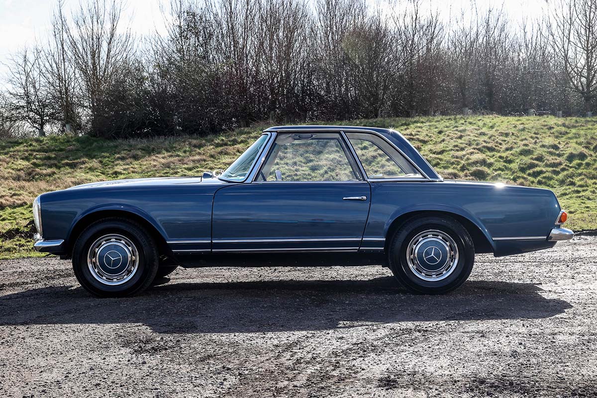 Side profile of the Mercedes Pagoda with concave hard top.