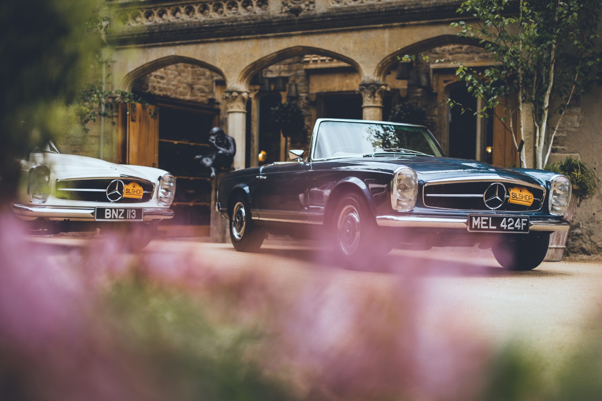 Two 280SLs side by side in The Cotswolds.