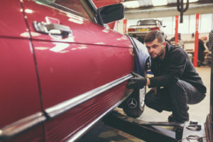 Inspecting a Mercedes Classic Car before it goes on sale at SLSHOP