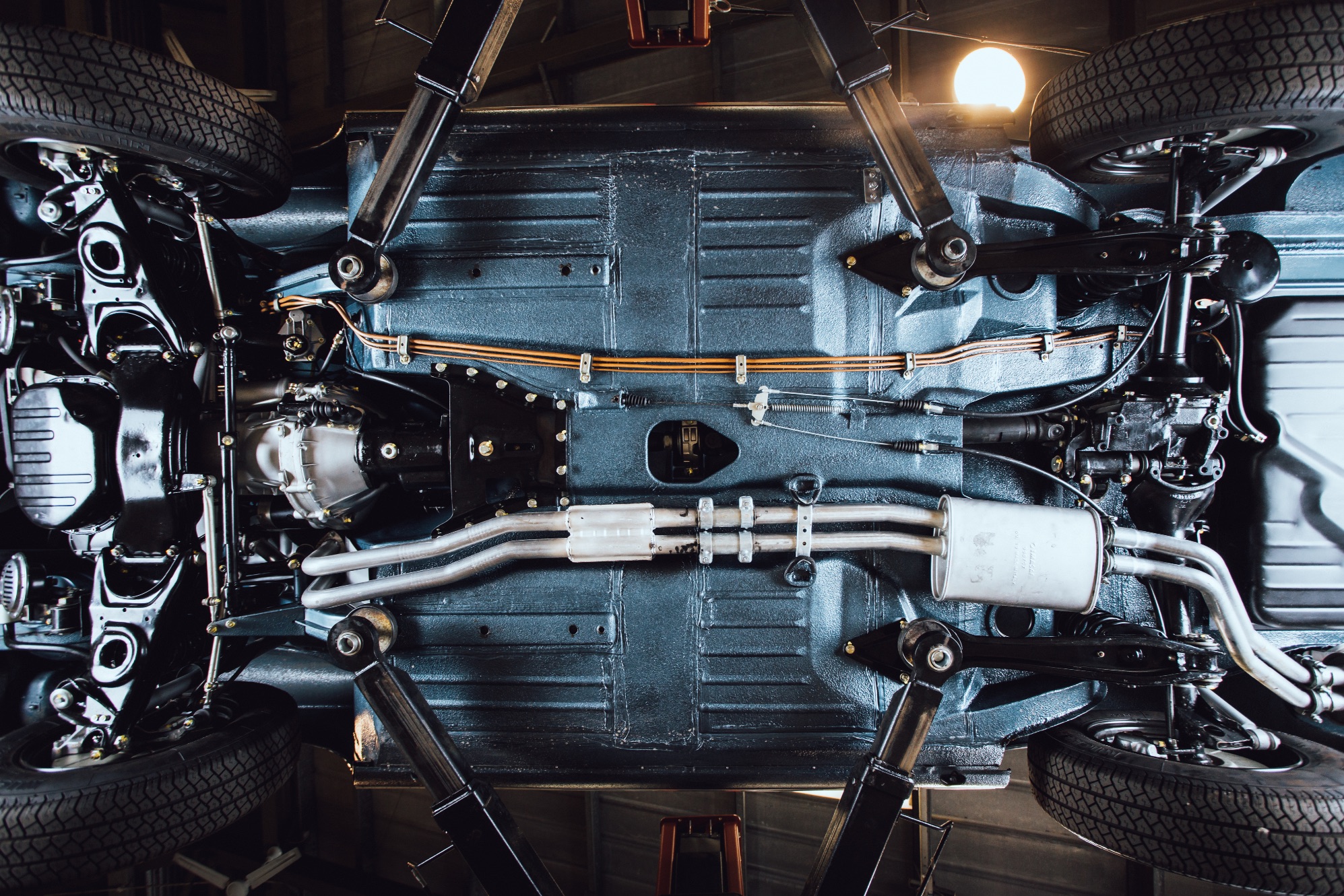 Man viewing undercarriage during R107 bulkhead repair 