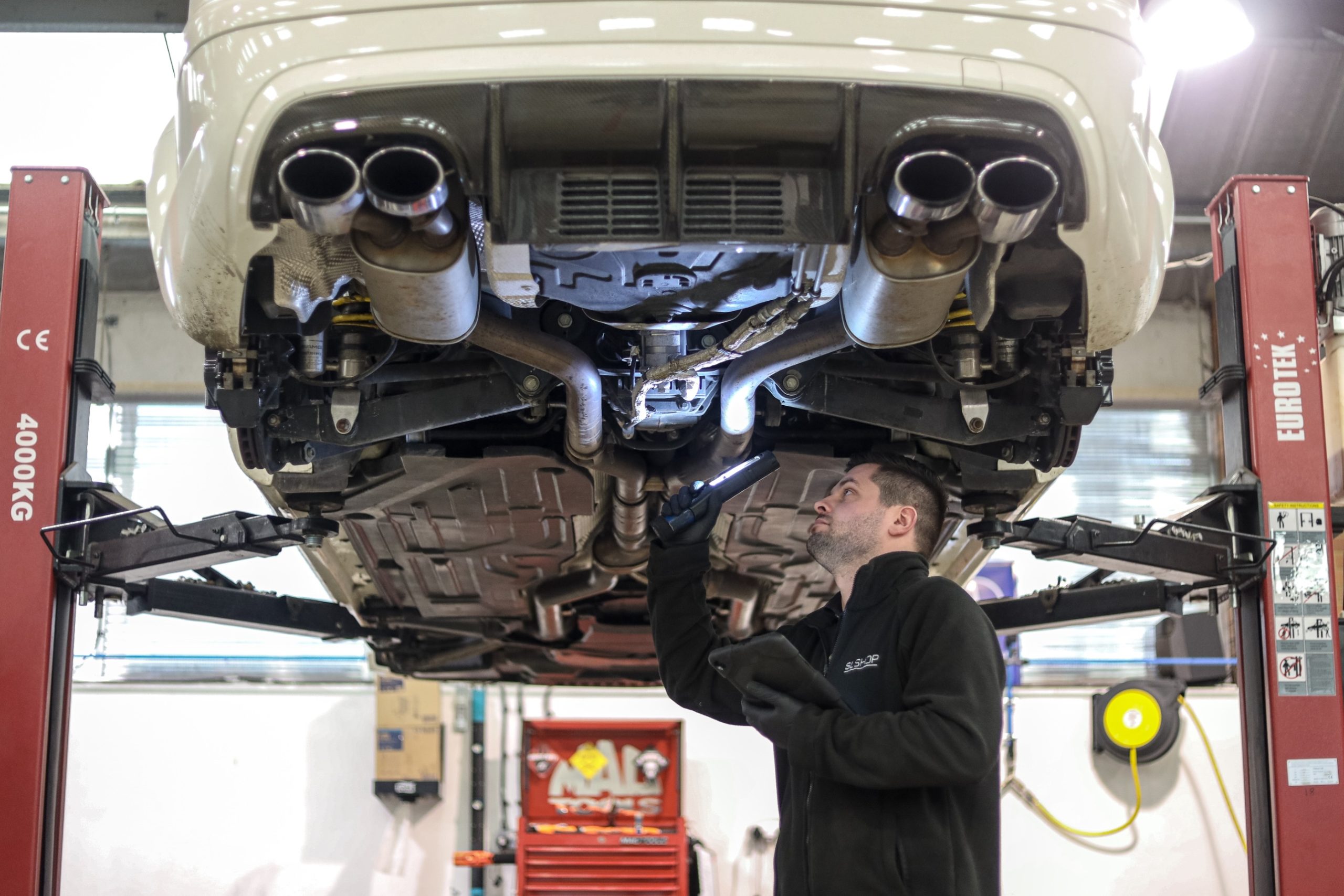 Man viewing undercarriage during R107 bulkhead repair 