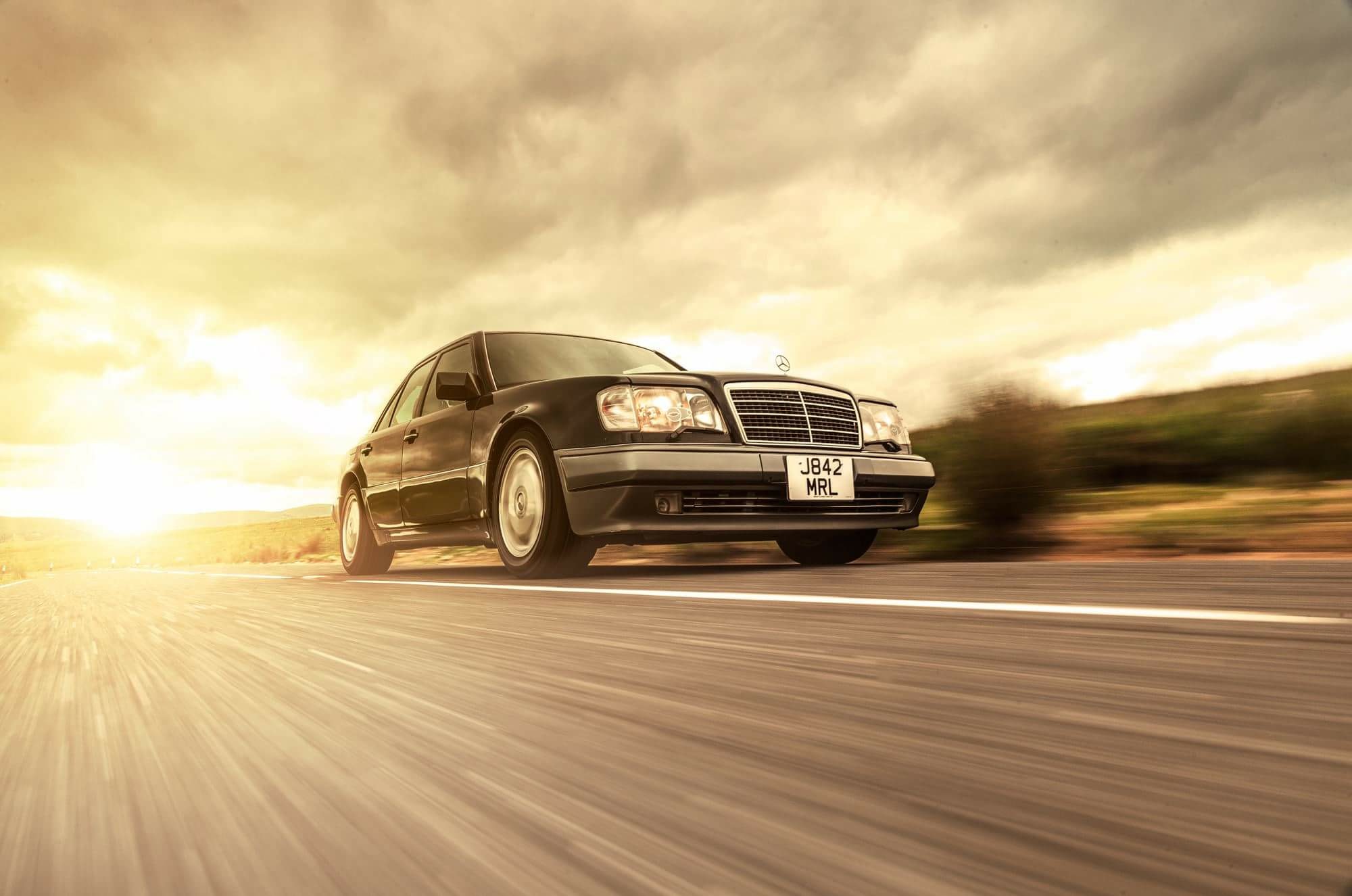 Mercedes R129 SL turning a corner.