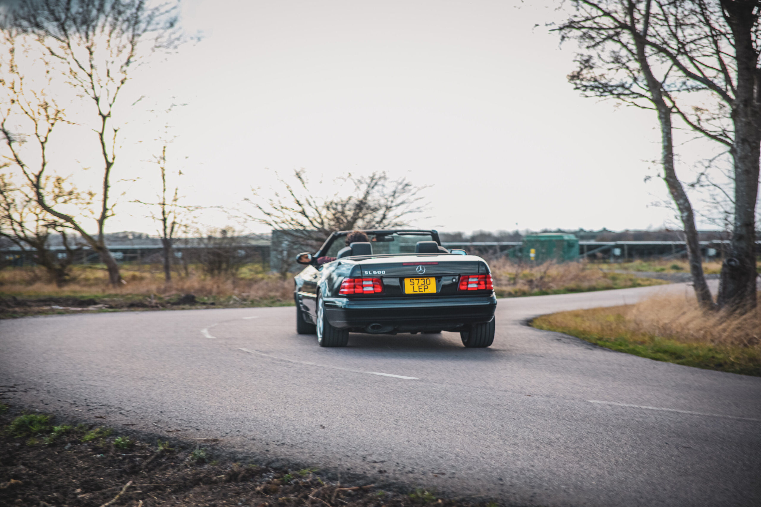 Mercedes R129 SL turning a corner.